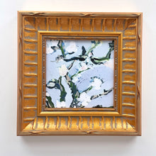 Load image into Gallery viewer, Nineveh Floral Square custom framed wall art with gold frame and blue textured canvas painting on a white wall.